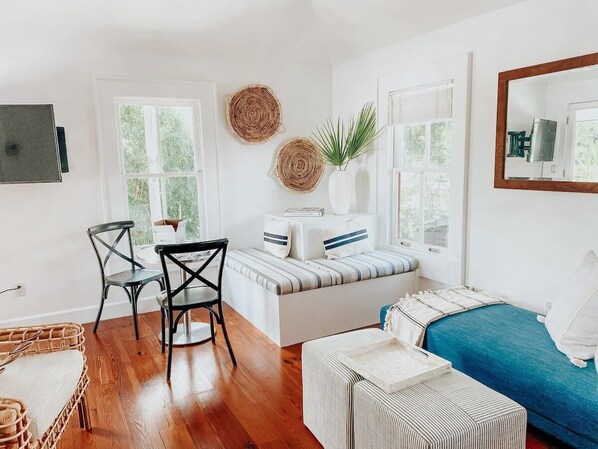 Living Room - Day Chaise Lounge, Built-In Corner Lounge, Bistro Set for 2, Smart TV.