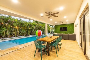 Outdoor dining table and TV.