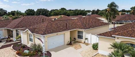 Beautifully landscaped with garage space for your car and golf cart