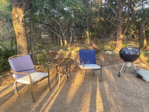 Chairs and charcoal grill. 