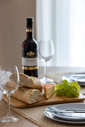 Close-up of a table with kitchenware and wine.