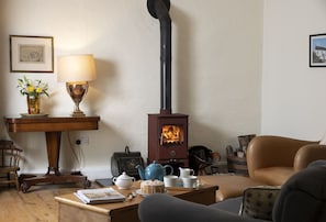 Ground floor: Sitting room with wood burning stove and relaxed seating