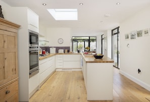 Ground floor: Open-plan living space with well-equipped kitchen