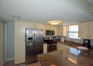 Fully equipped/updated kitchen with SS appliances and granite counter tops.