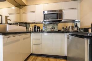 This unit comes with a coffee maker and a microwave, stove and refrigerator 
