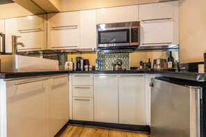 This unit comes with a coffee maker and a microwave, stove and refrigerator