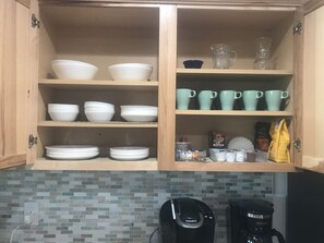 Lots of dishes, pots and pans, crockpot, etc.