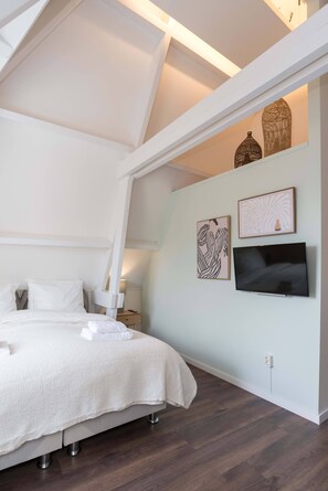 Comfy double bed in the first bedroom 