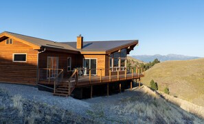 The large porch is the perfect spot to take in the mountain views.