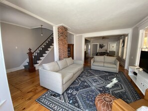 Living room with stairs going upstairs 