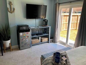 Big screen TV is great for relaxing and watching TV in the comfy queen size bed 