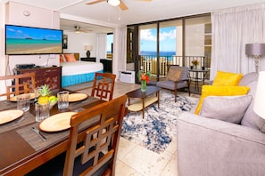 Living room with ocean views, pull-out sleeper sofa and dining area