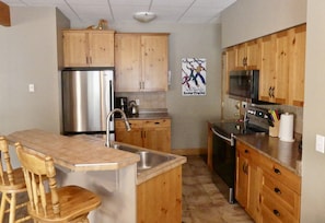 Open Kitchen with Stainless Steel Appliances