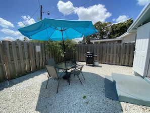 Fenced in backyard, outdoor area, large umbrella, dining table that accommodates 4 people and gas BBQ grill, utensils and propane provided! 