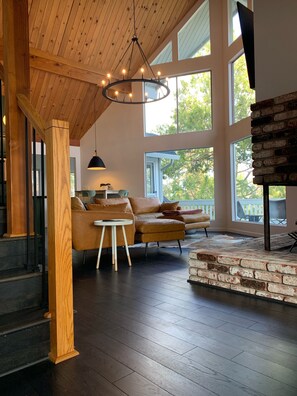 The “Great Room” has high A-Frame ceilings that look East toward Yosemite