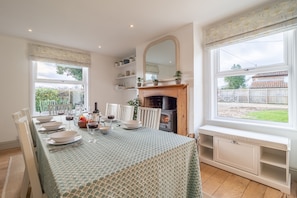 Brook House, Brinton: Wood burning stove in the dining area