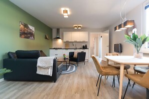 Open-plan living and kitchen area, fully equipped for a comfortable and enjoyable stay.