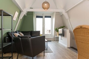 Comfortable sofa and armchair in the stylish living room.