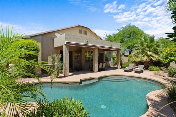 Private backyard with pool. 