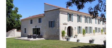 The view of the house from the wood