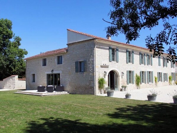 The view of the house from the wood