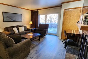 Living Room - Comfortable seating for 6, Desk, Private balcony.