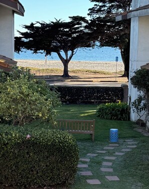 Balcony view of volleyball courts and calming sound of the waves all day!