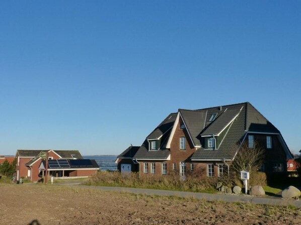 Haus Nordlicht mit Blick ins Wattenmeer in Nebel auf Amrum