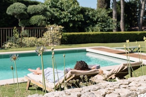 Chilling by the pool, permanently heated at 30 degrees