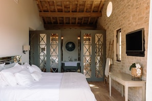 The Master has an en suite bathroom, a flat screen TV, and a "Nespresso cabinet"