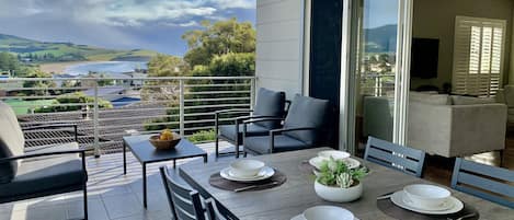 Relax and dine on the balcony with mountain and sea views