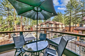 The balcony offers a shaded dining table for 4.