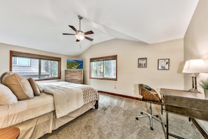 Bedroom 2 is downstairs with a king bed, 50" TV, ceiling fan, workstation, and ensuite bathroom.