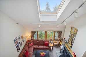 Aerial view of the open floor living space. Enjoy all the natural light with the four large windows.