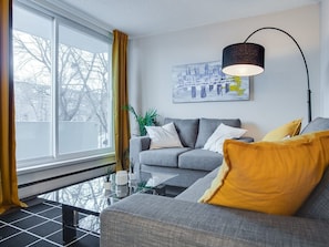 Living room with a walk out patio for fresh air!