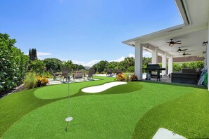 Three hole, custom turf mini golf course and lake view