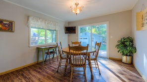 Dining Room table can seat 8 with a leaf. Walk out to a south facing deck.