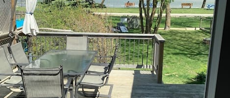 view of the lake from the front deck, features table with seating for six