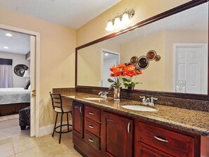 Master bathroom with double sinks and granite counter tops