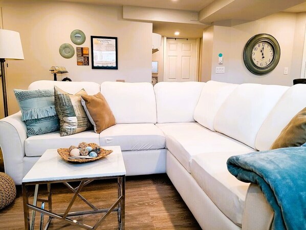 Bright, private, living space w/super comfy sectional couch. Our guests love it!