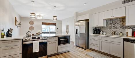 Save money cooking in with our completely remodeled and upgraded kitchen.  All new appliances, cabinets, counters and finish work completed in October 2022.