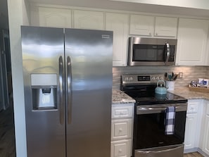 Stainless Fridge/Range/Oven and Microwave