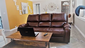 Perfect couch for work or play, features plugs, usb ports & coffee table desk.