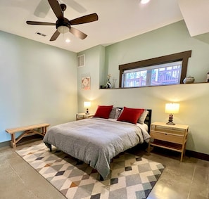 Cozy bedroom tucked in the rear of the suite with a queen-sized mattress. 