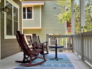 Private tranquil deck overlooking a verdant ravine. 