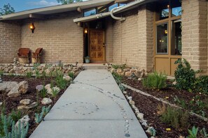 El Caracol's front entrance with late summer flora