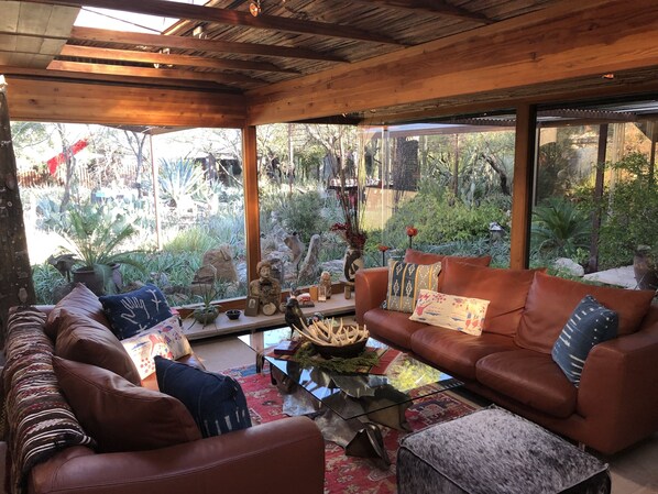 Breathtaking living room to take in the cactus garden and birds