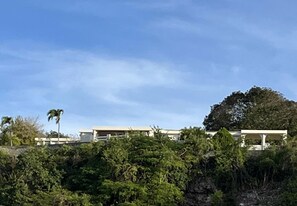 The view of the property from the bottom of the ridge shows the large plot.