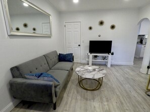 HD SmartTV and Sofa that folds flat to a 2nd bed