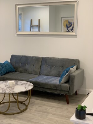 Sofa that converts as a futon bed for a 3rd guest!